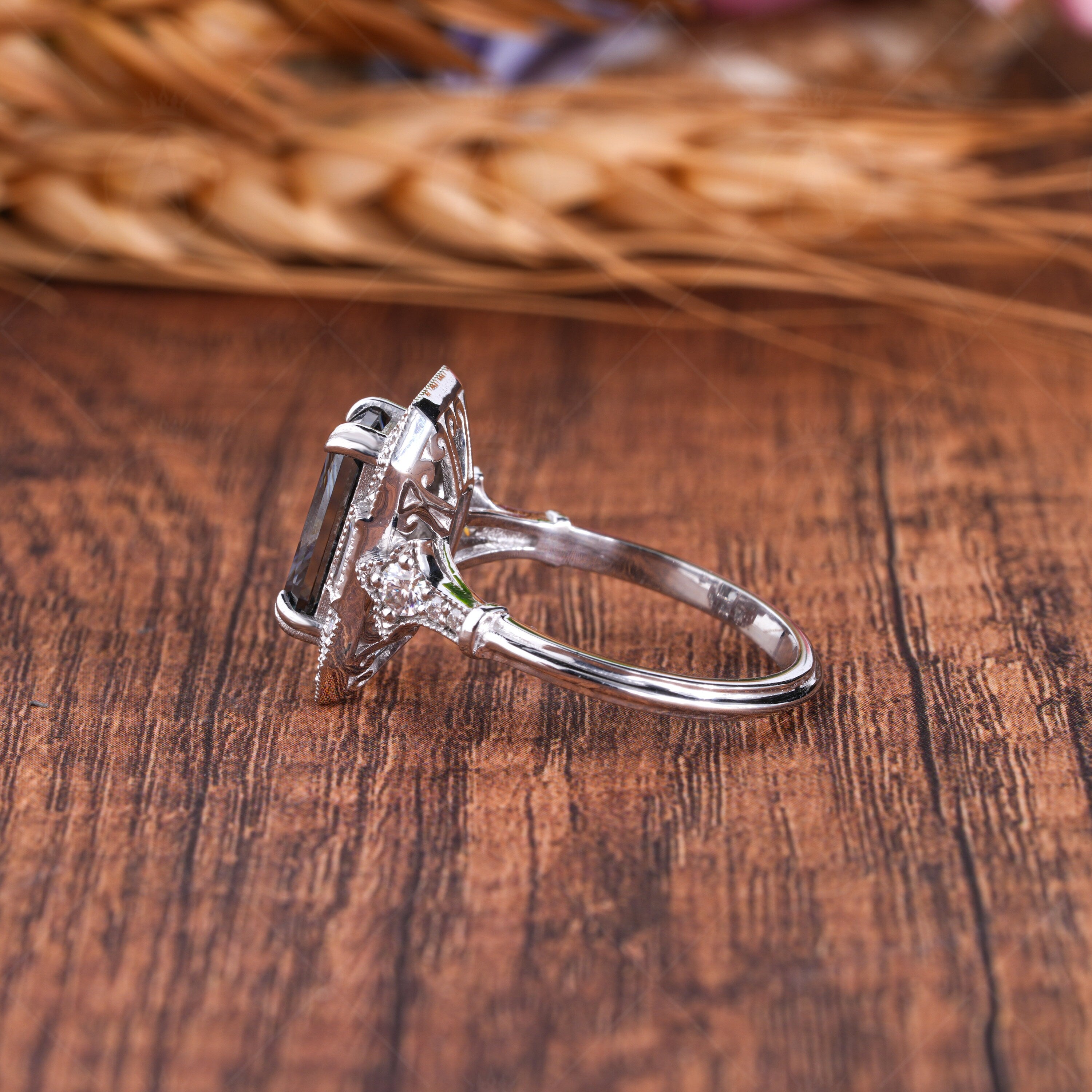 Elongated gray radiant cut Edwardian engagement ring with intricate vintage detailing. A timeless, elegant design perfect for romantic proposals.