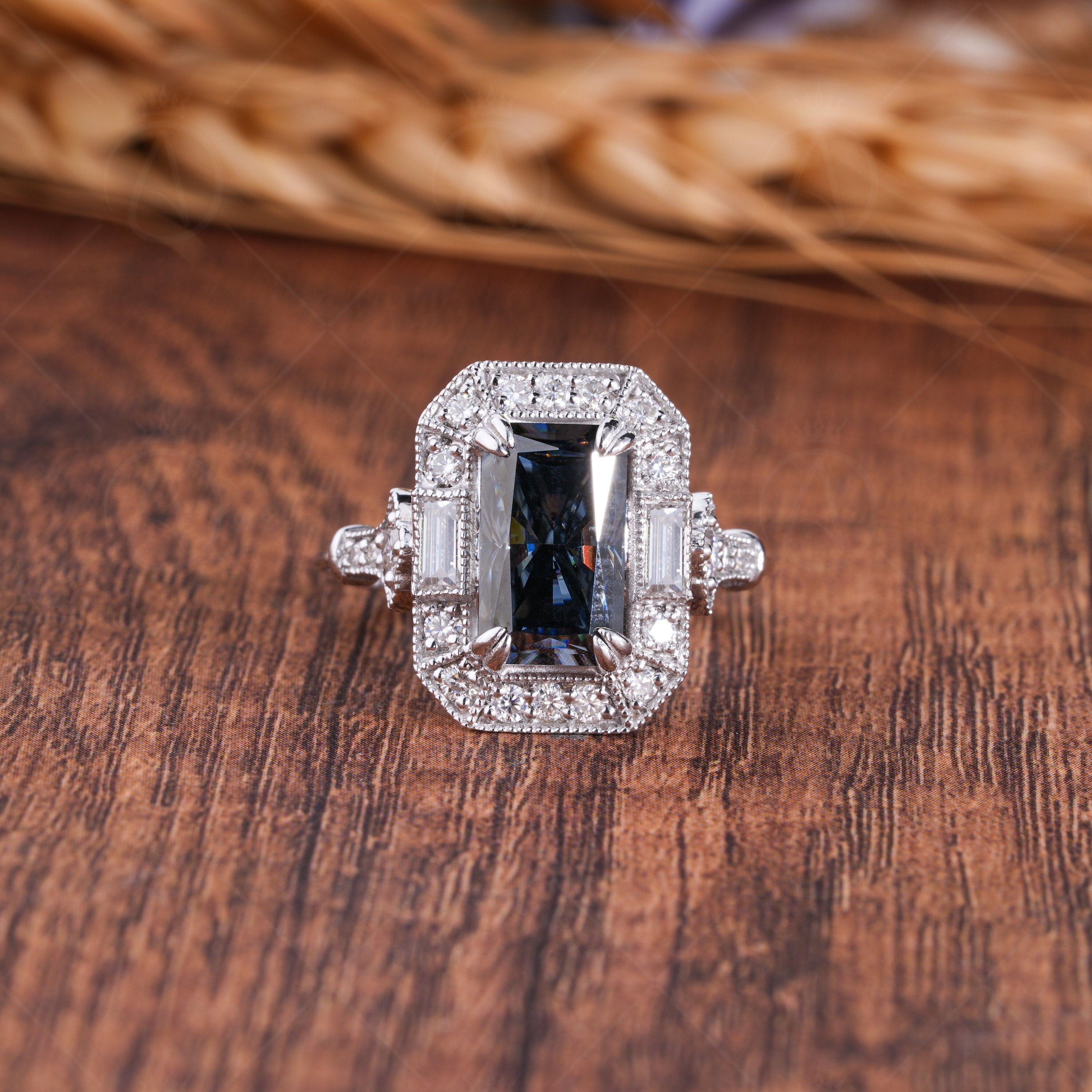 Elongated gray radiant cut Edwardian engagement ring with intricate vintage detailing. A timeless, elegant design perfect for romantic proposals.