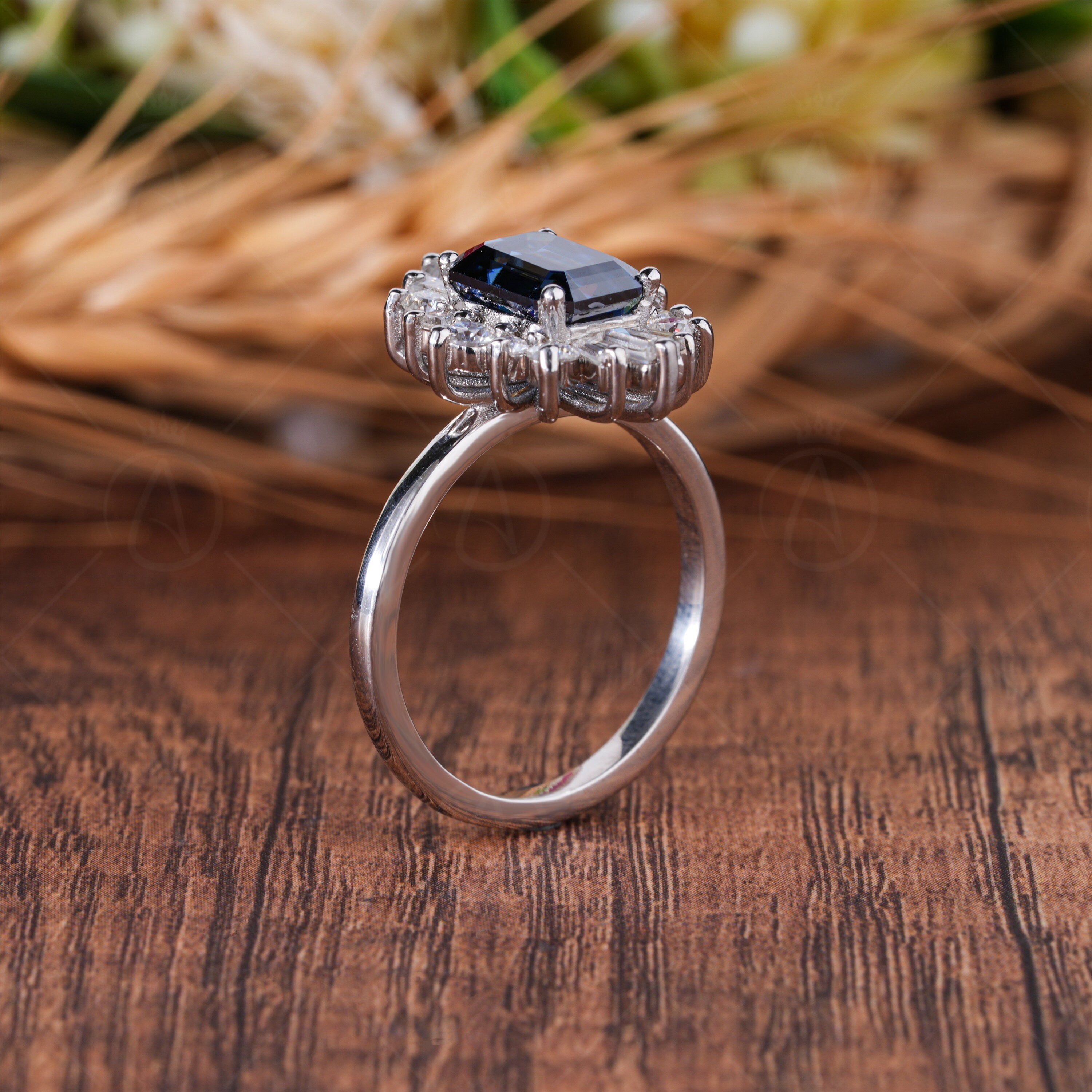 Blue Emerald Cut Halo Starburst Engagement Ring