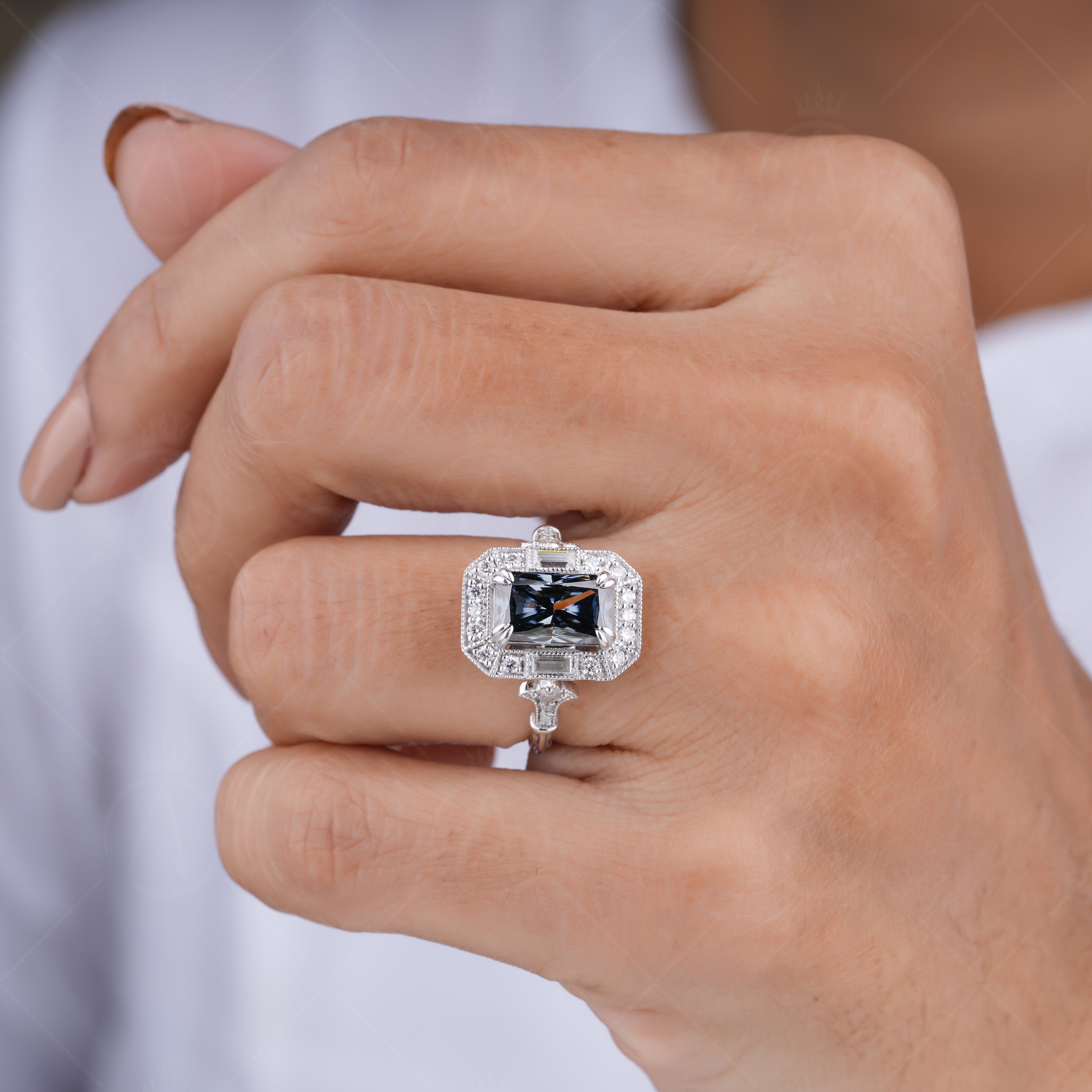 Elongated gray radiant cut Edwardian engagement ring with intricate vintage detailing. A timeless, elegant design perfect for romantic proposals.