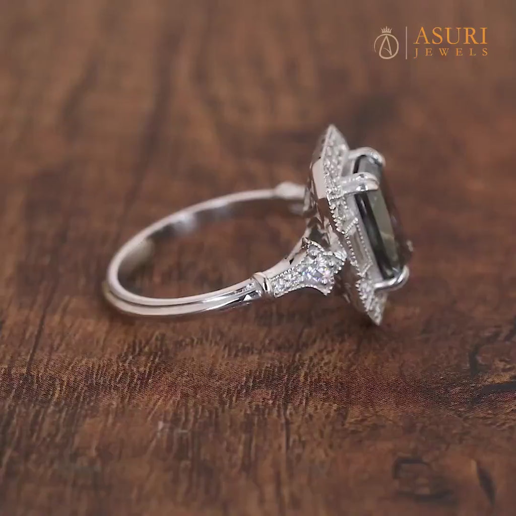 Elongated gray radiant cut Edwardian engagement ring with intricate vintage detailing. A timeless, elegant design perfect for romantic proposals.